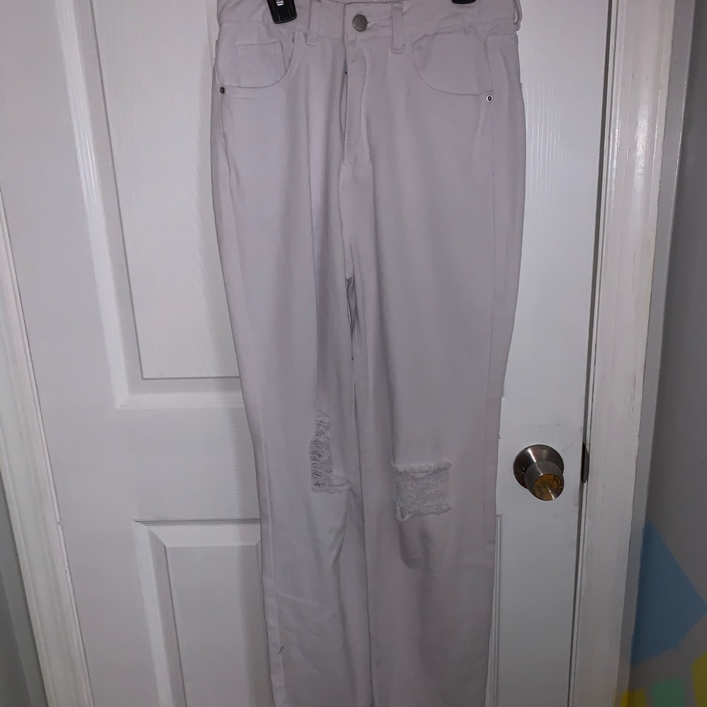 wide legged white jeans with rips